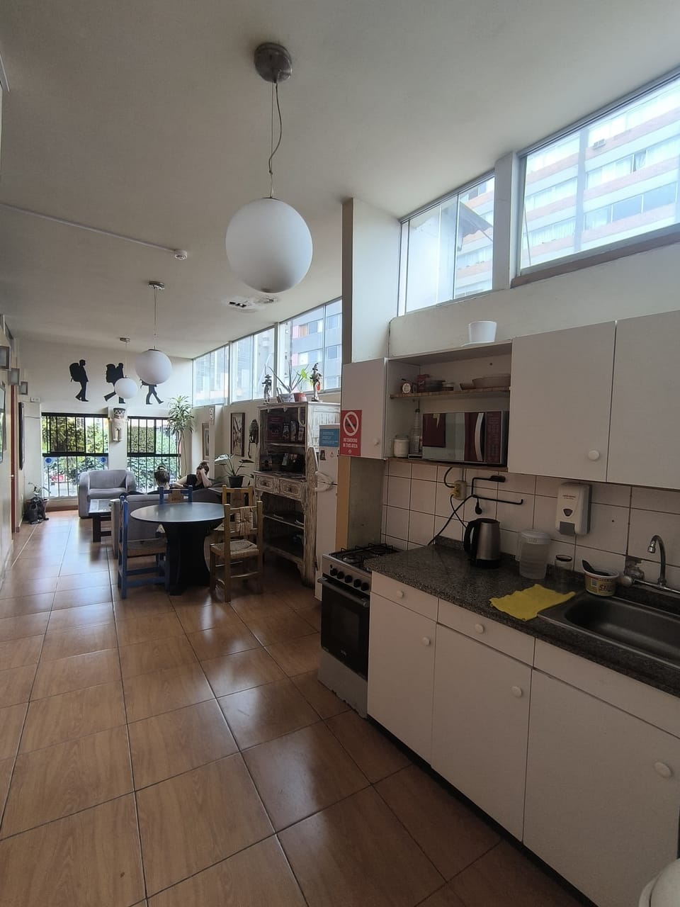 Full-size fridge, microwave, cookware/dishes/utensils, paper towels