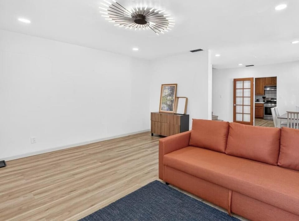 Gather in the open living space, where relaxing on the sofa flows easily into meals and time together.