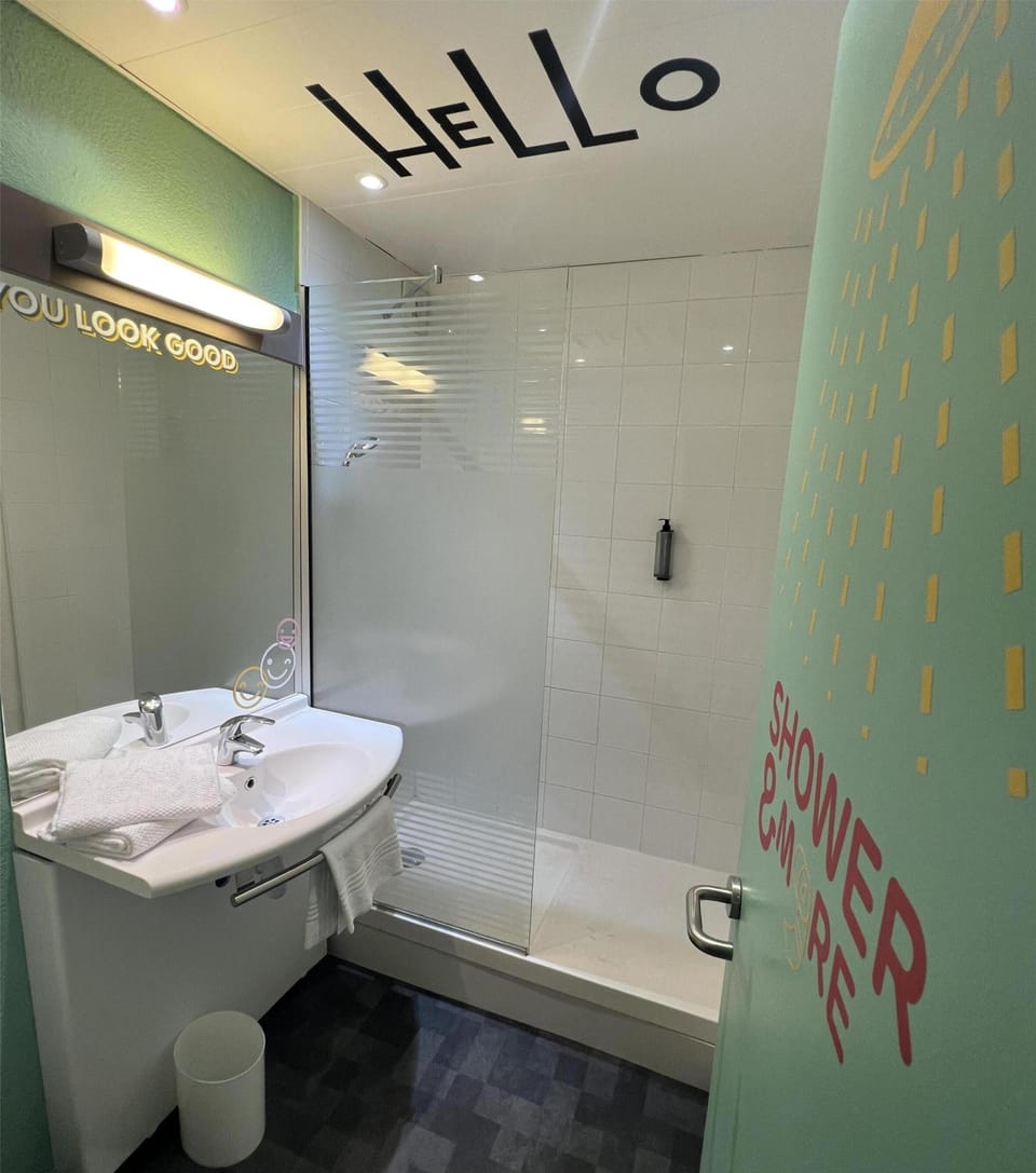 Shower, eco-friendly toiletries, towels, toilet paper