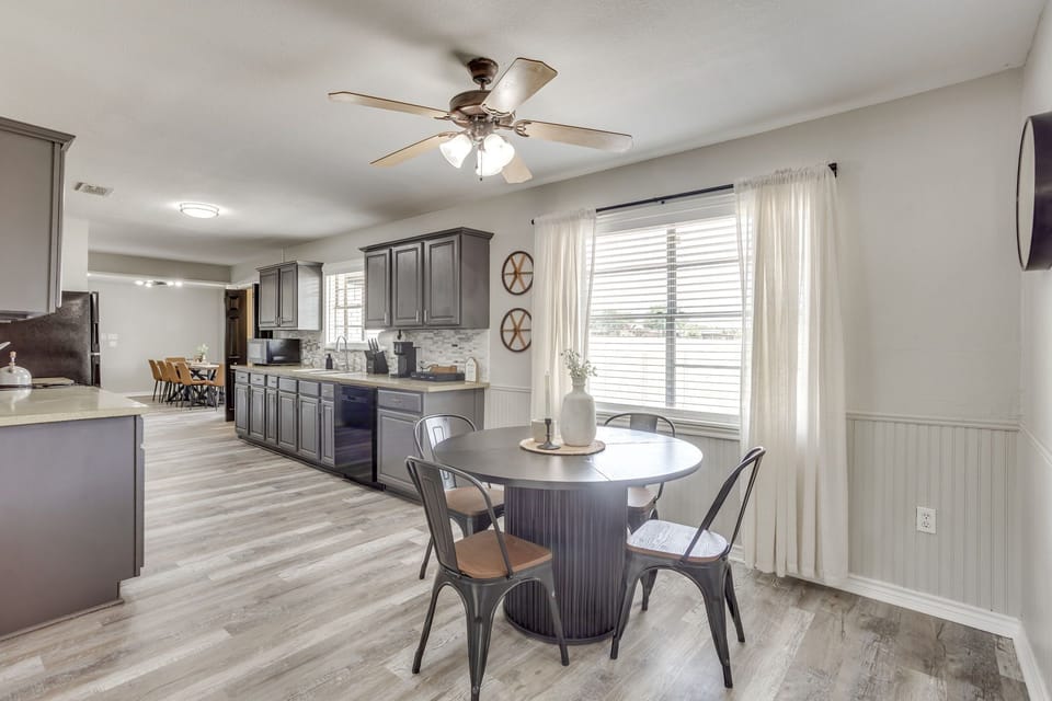 Kitchen and breakfast nook with a round table for coffee, cards, or a laptop. With the main dining table on the other side of the kitchen