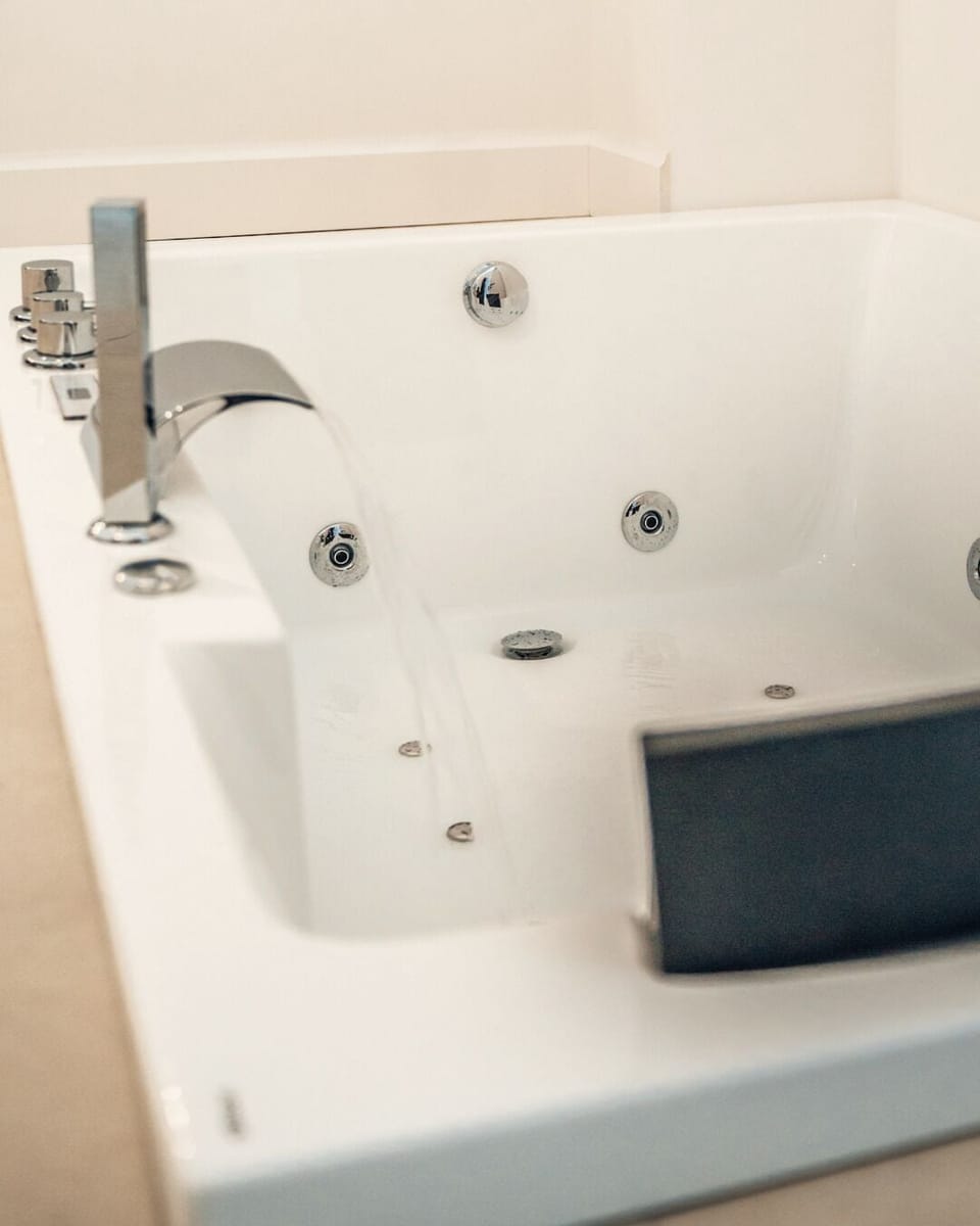 Deluxe Room (Sciara) | Bathroom | Hair dryer, towels