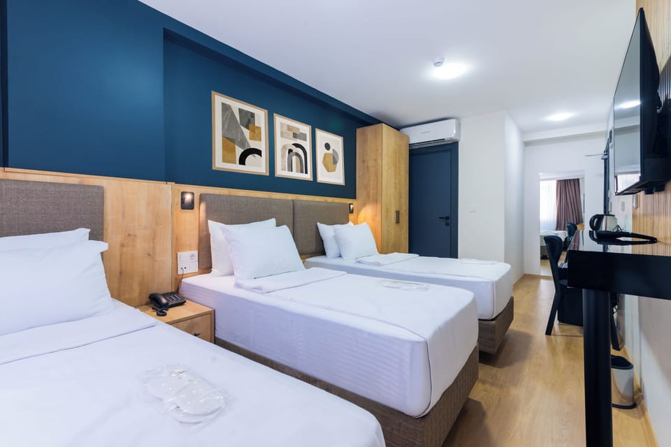 Standard Triple Room, City View | Egyptian cotton sheets, premium bedding, Select Comfort beds, minibar