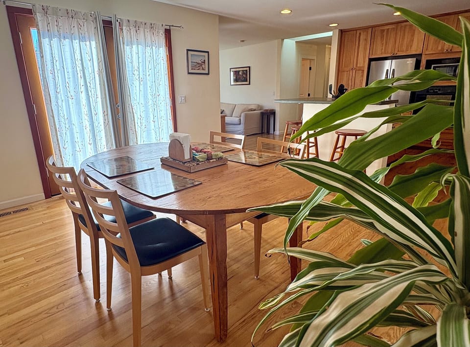 The open kitchen and dining area make it easy to cook, gather, and spend time to