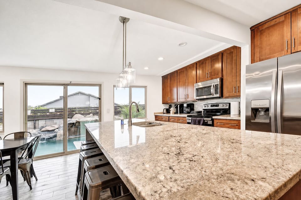 Beautiful kitchen with pool views. 