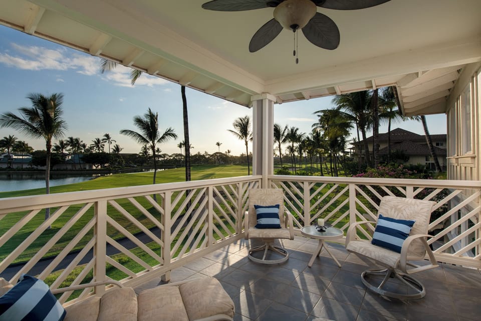 Step onto your private covered lanai and sink into plush seating overlooking lush fairways and swaying palms. The tropical breeze flows freely as you unwind with a view that makes every moment feel like paradise.