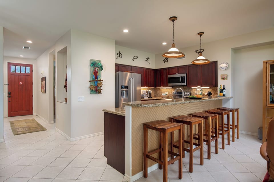 Your fully equipped kitchen makes vacation dining easy, with granite countertops, modern appliances, and plenty of seating at the breakfast bar for family gatherings or morning coffee.