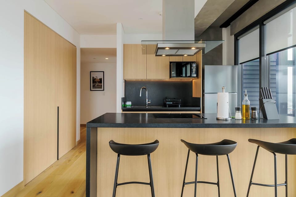 Modern open kitchen with a breakfast bar for three