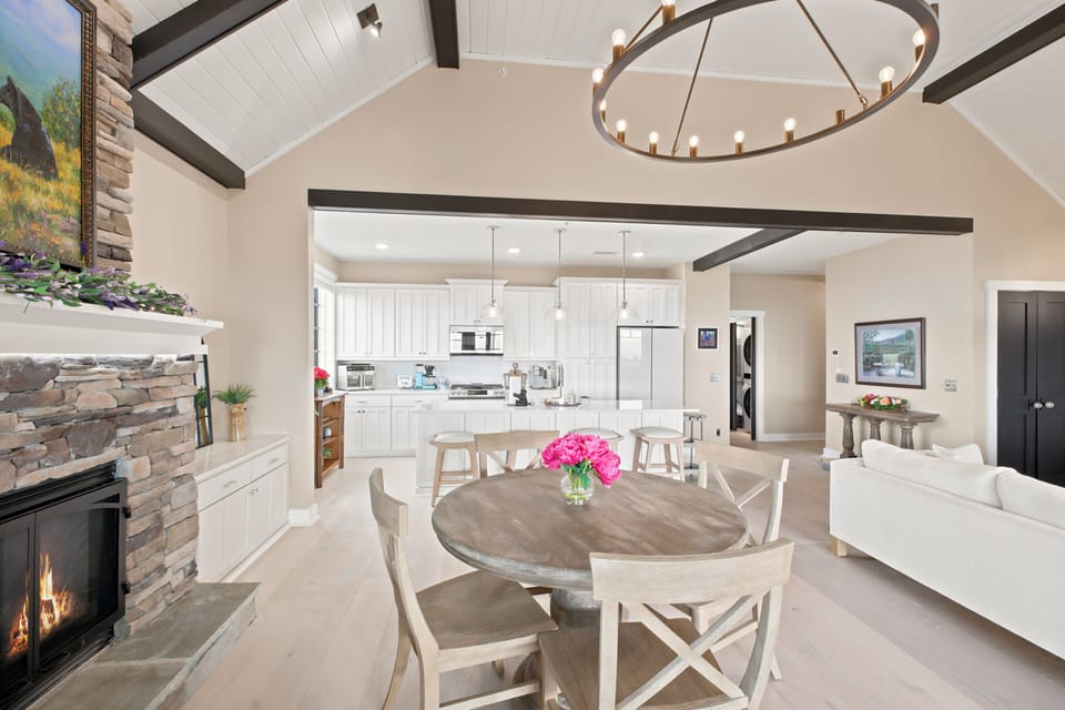 Everything is within a few steps of everything else: kitchen, dining, fire, and the door to the balcony. It is a condo that lives a lot bigger than its square footage.