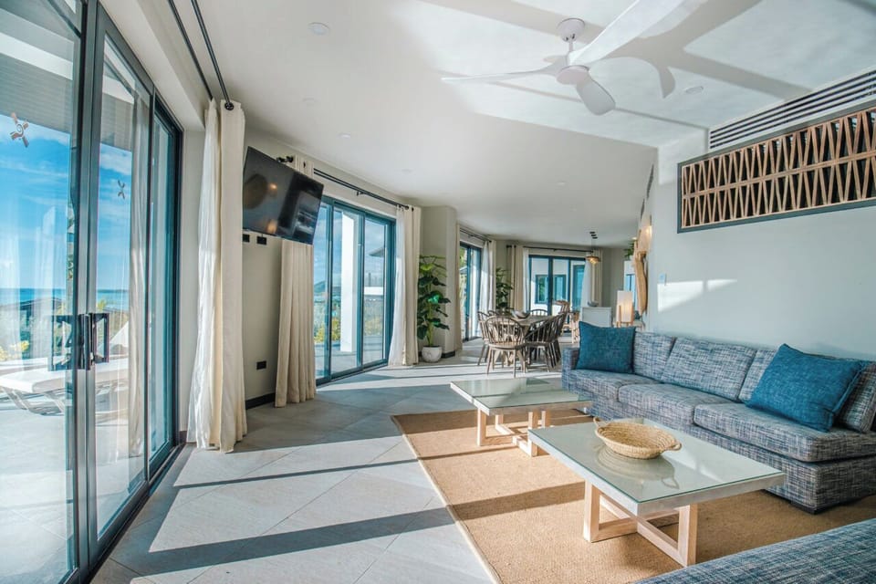 Lounge on the sofa as ocean breezes drift indoors.