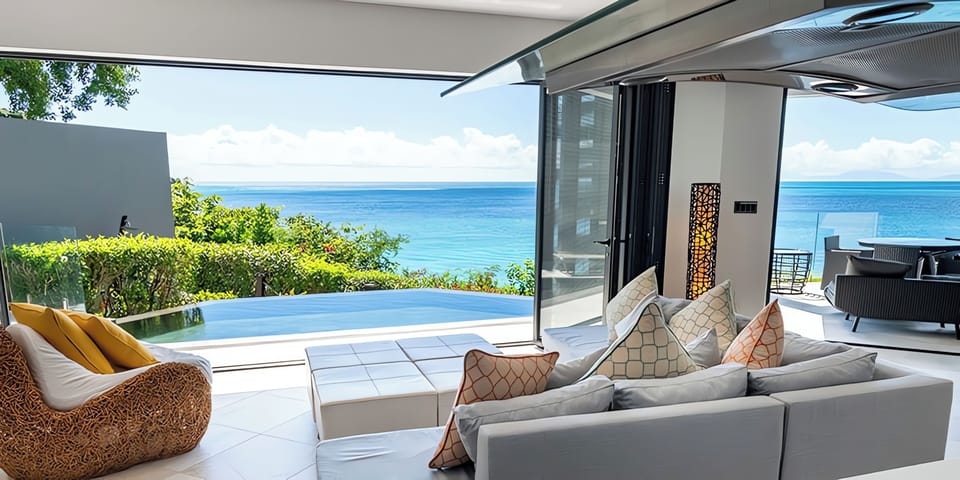 Lounge in airy comfort as the ocean sparkles outside.