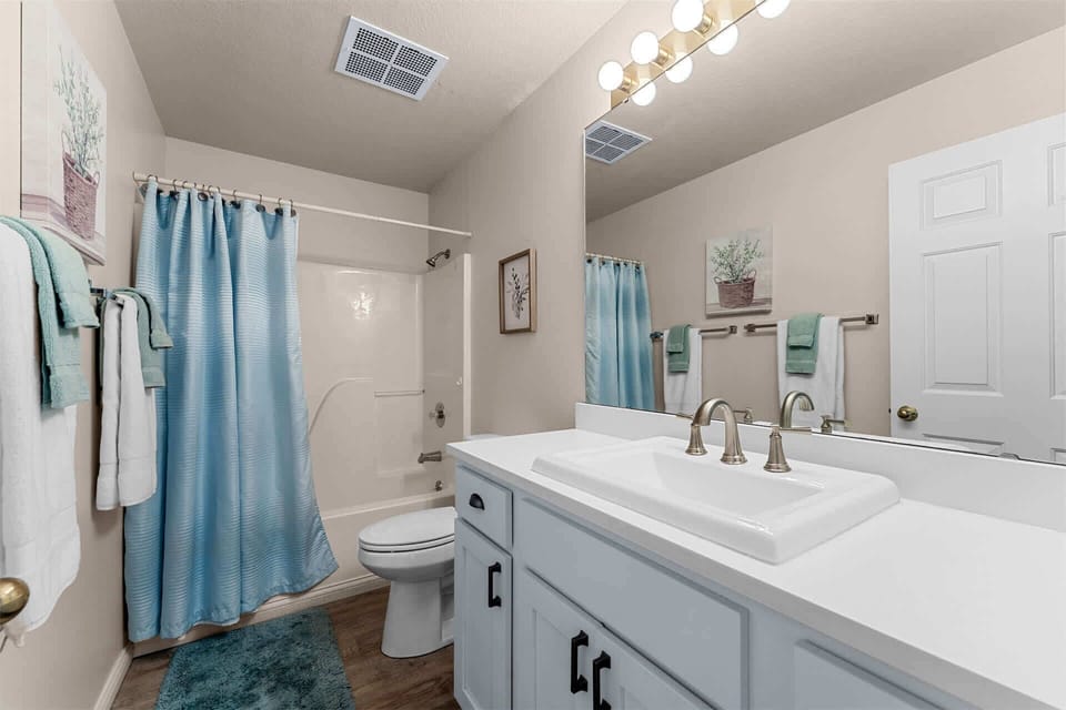 Wash up in the first full bath, featuring a single vanity & shower/tub combo​