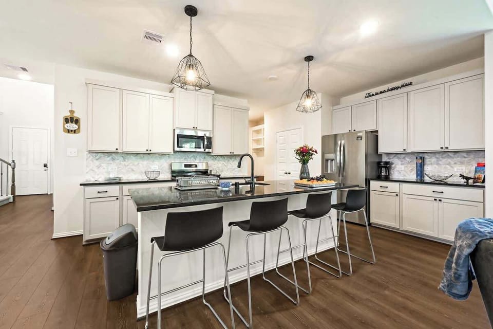 Spacious kitchen with large island, perfect for gathering.