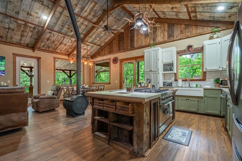 The open-concept great room combines rustic charm, soaring ceilings, and plenty of space to relax together.