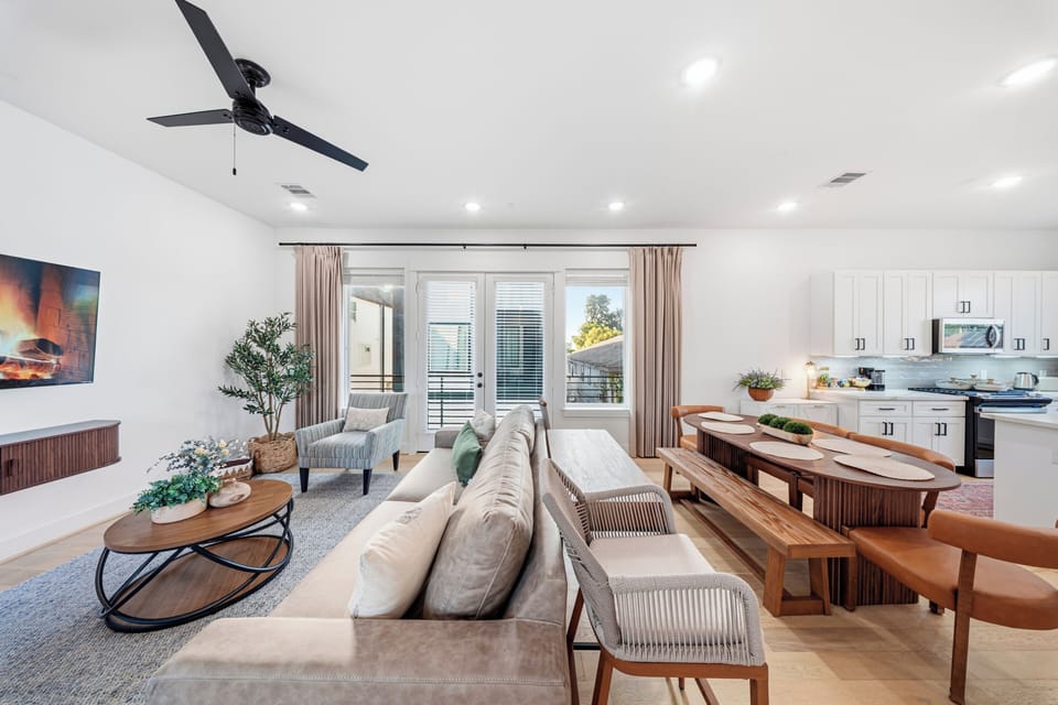 Bright open-concept living space with stylish dining and kitchen area