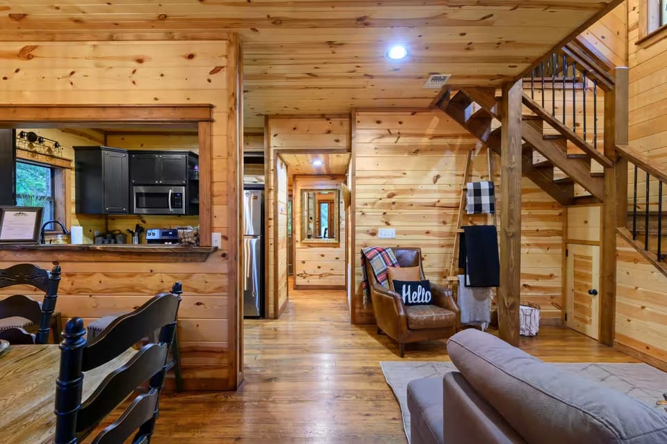 Living Room: Inviting wood accents and warm lighting create an ideal space for relaxation!