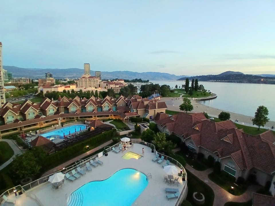 beach visible, pool visible, beach view, outdoor pool, summer, terrace patio, outdoor, body of water, mountain