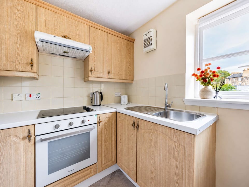 The kitchen is fully equipped to prepare a simple meal 