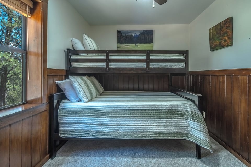Twin over full bunk bed (sleeps 3) located upstairs. Also has a rollaway bed