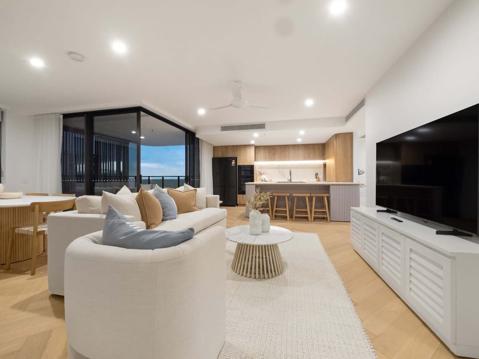 The lounge faces the water, with the television off to the side.