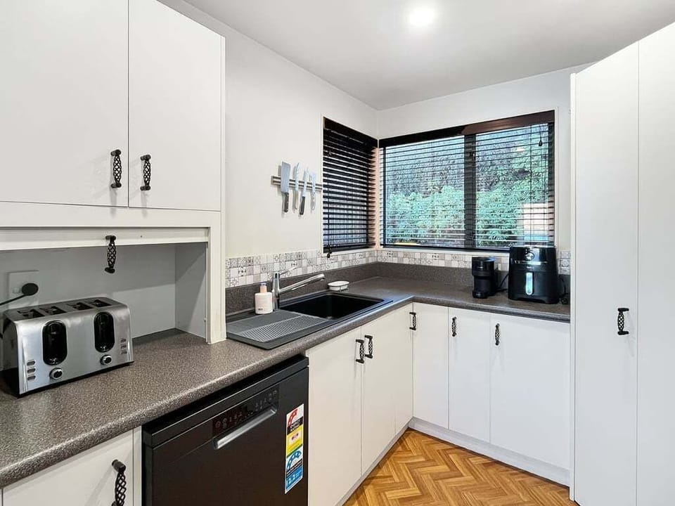 Fully equipped kitchen with everything needed to prepare meals during your Queenstown stay.