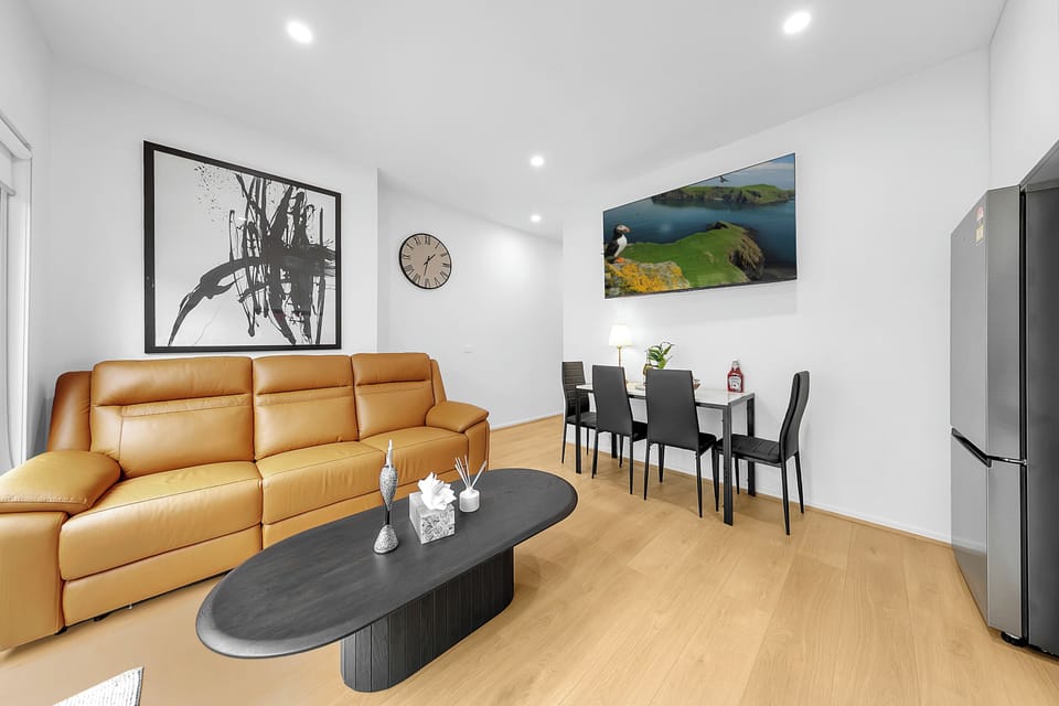 Bright modern lounge with comfy leather sofa and stylish dining area