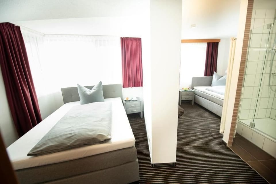 Standard Twin Room, Garden View | Desk, soundproofing, iron/ironing board (on request), WiFi (free)