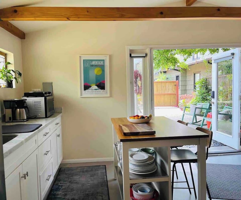 Kitchen and french doors leading to the outdoor patio and seating area. 