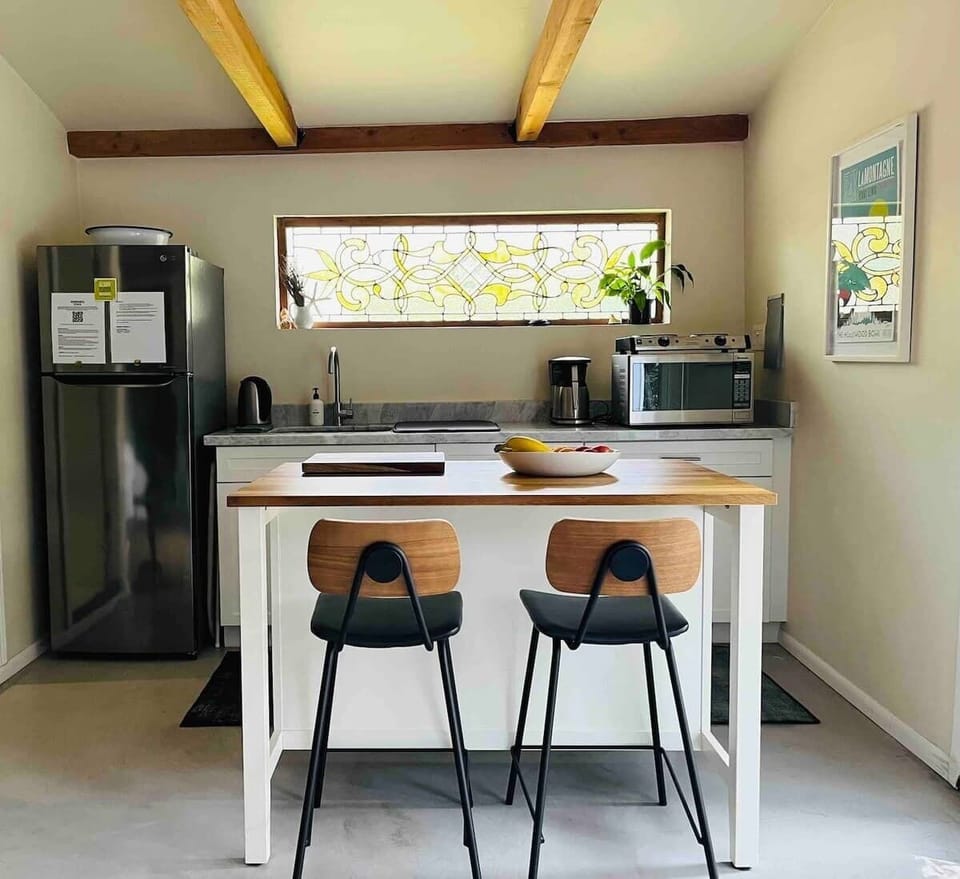 Kitchen Island to sit on stools and eat or also work on your computer.