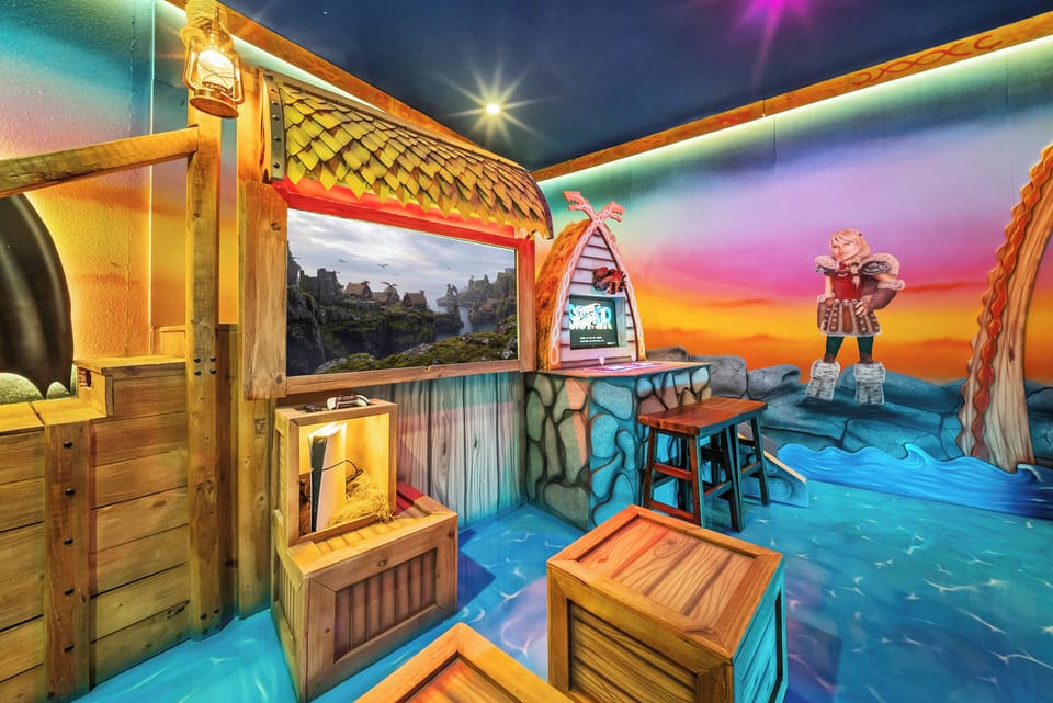 Experience a vibrant and playful space adorned with a charming seaside mural and rustic wooden accents. The textured flooring and inviting bar stools set the perfect atmosphere for your relaxation and enjoyment.