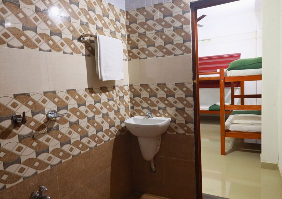 Comfort Shared Dormitory | Bathroom | Shower, towels, soap, shampoo