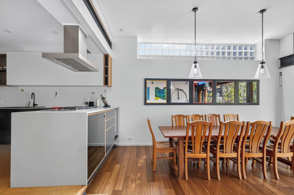 Gather around the dining area, where warm timber finishes and natural light create an inviting setting for leisurely breakfasts, home-cooked dinners or takeaway from your favourite local eatery.