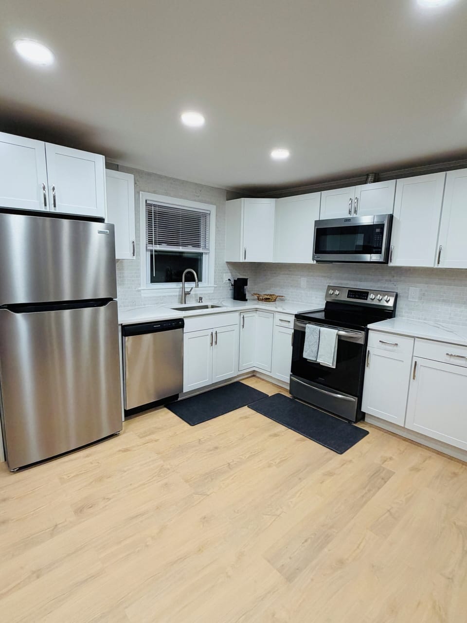 Bright modern kitchen with stainless appliances and ample counter space