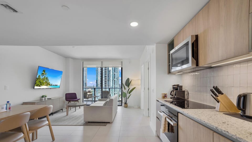 Condo, Balcony, City View | Private kitchen | Espresso maker, fridge, dishwasher, cookware/dishes/utensils