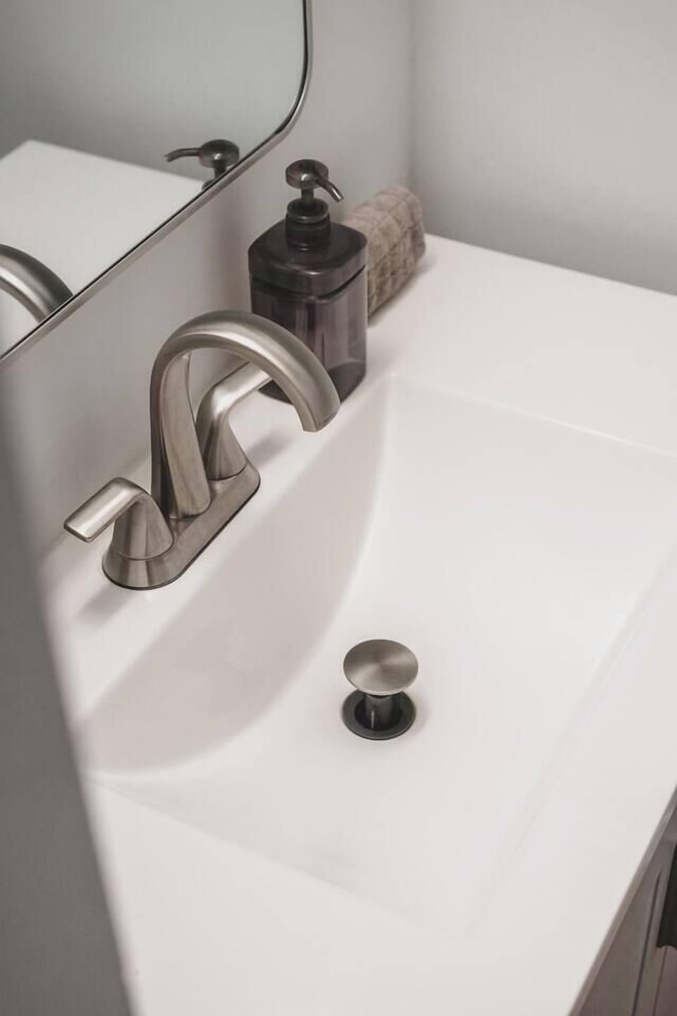 Bright, well-maintained bathroom with modern fixtures and convenient guest essentials.