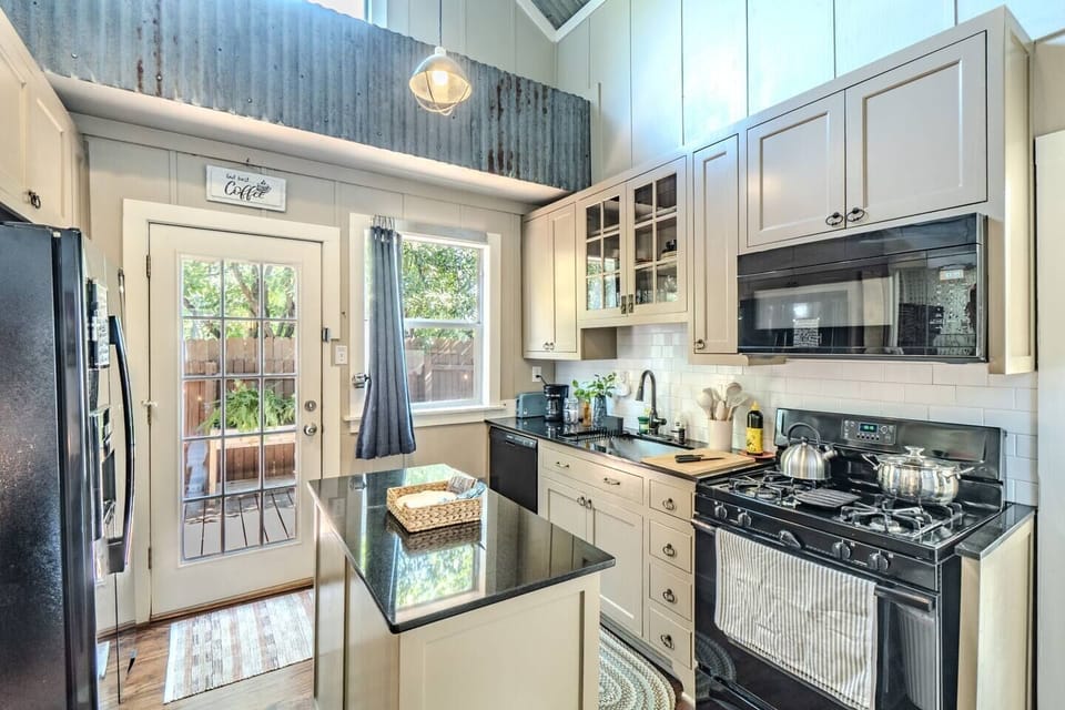 Whip up delicious meals in this fully equipped, stylish kitchen.
