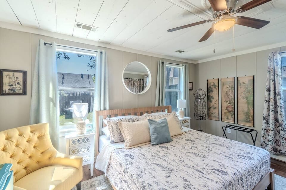 Enjoy a quiet morning in the cozy reading nook of this bright bedroom.
