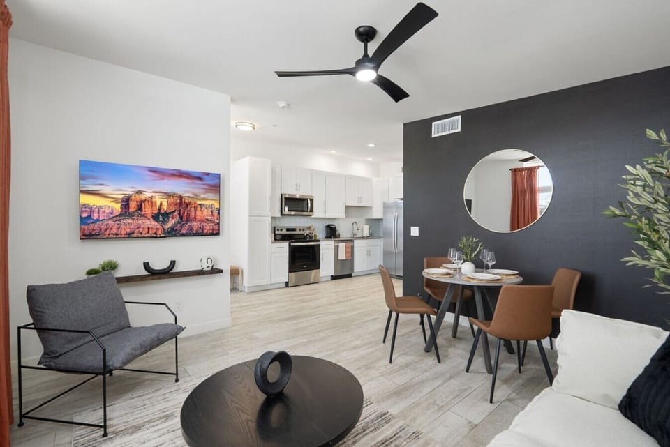 Modern comfort meets timeless style in this inviting open-concept living area with space to relax and dine.