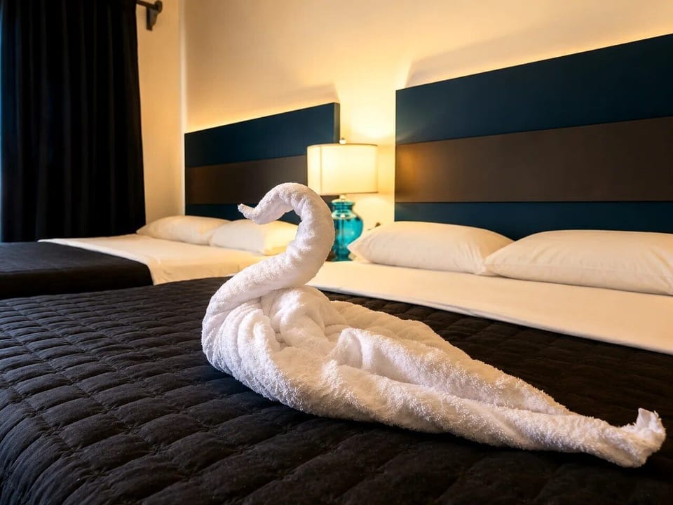 Deluxe Quadruple Room | Blackout drapes, WiFi (free), bed sheets