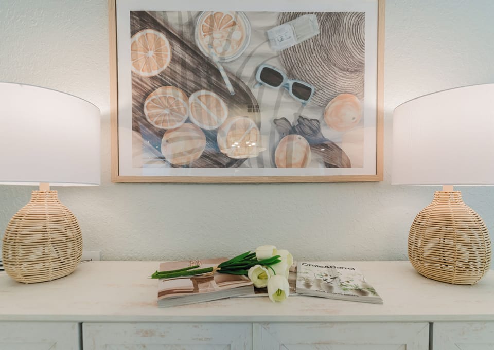 Share unforgettable meals around the spacious dining table with seating for eight, while the oversized kitchen island provides seating for four more. Whether it's a family dinner, holiday celebration, or casual brunch, this bright, coastal-inspired space c