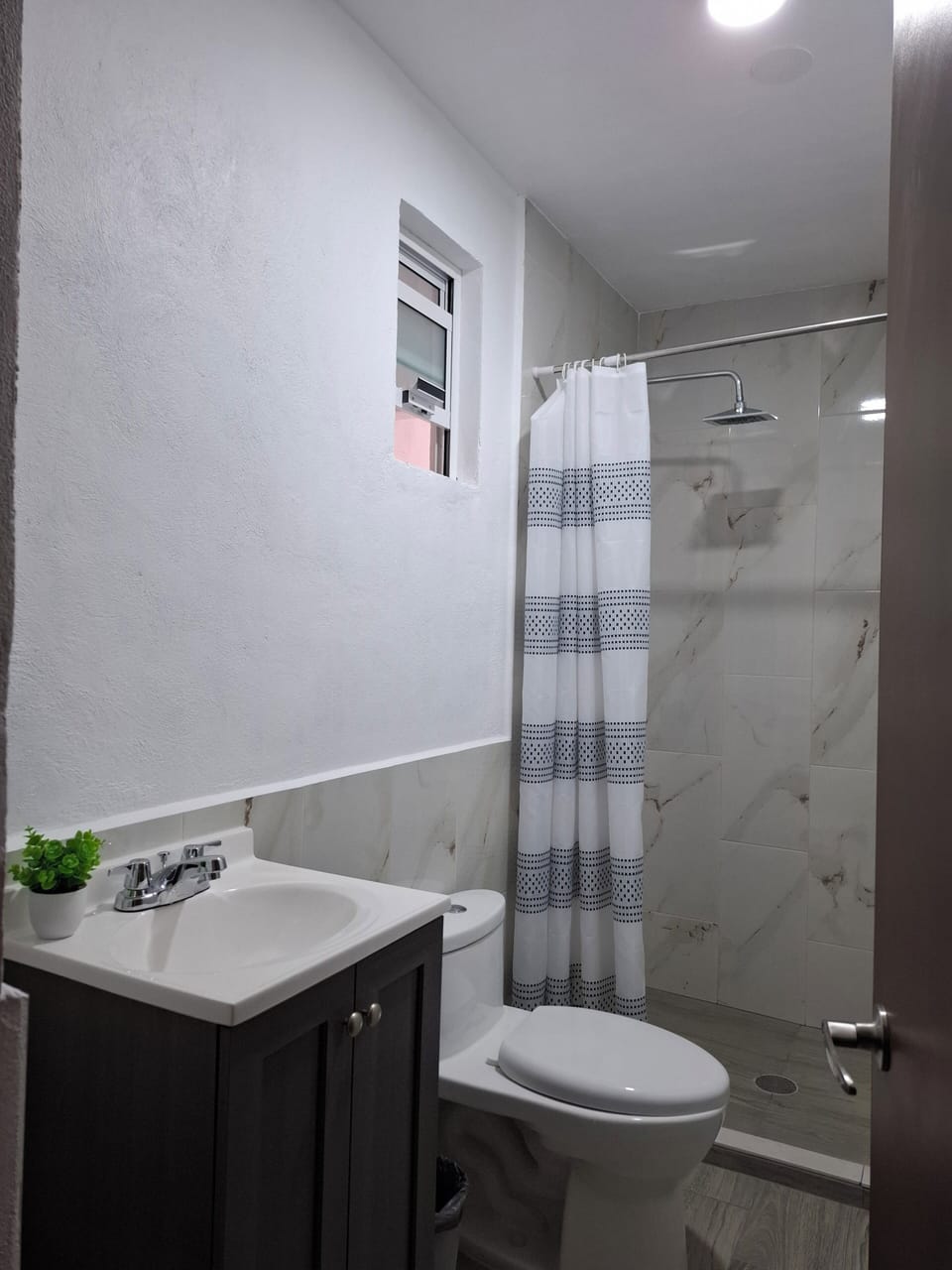 Bathtub, towels, soap, shampoo