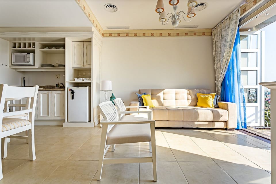 Basic Apartment | Living area | 40-inch TV with digital channels