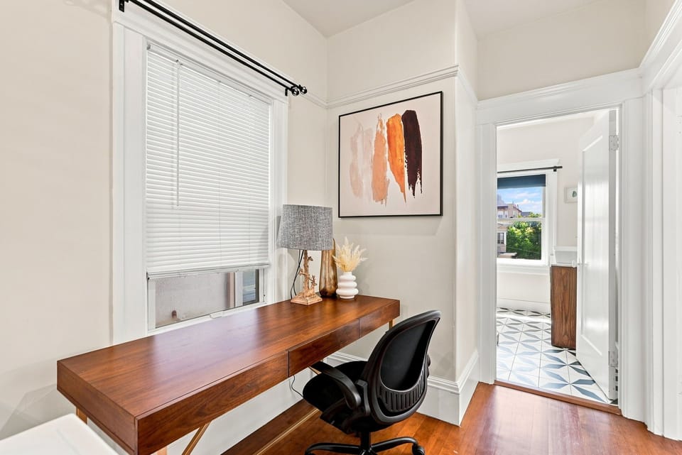 Bright work nook with stylish desk, natural light, and remote-work appeal
