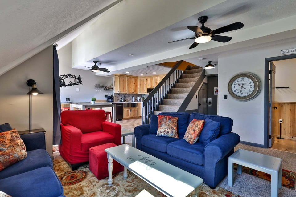 Vaulted ceilings and an open staircase give the main living area a bright, spacious feel.
