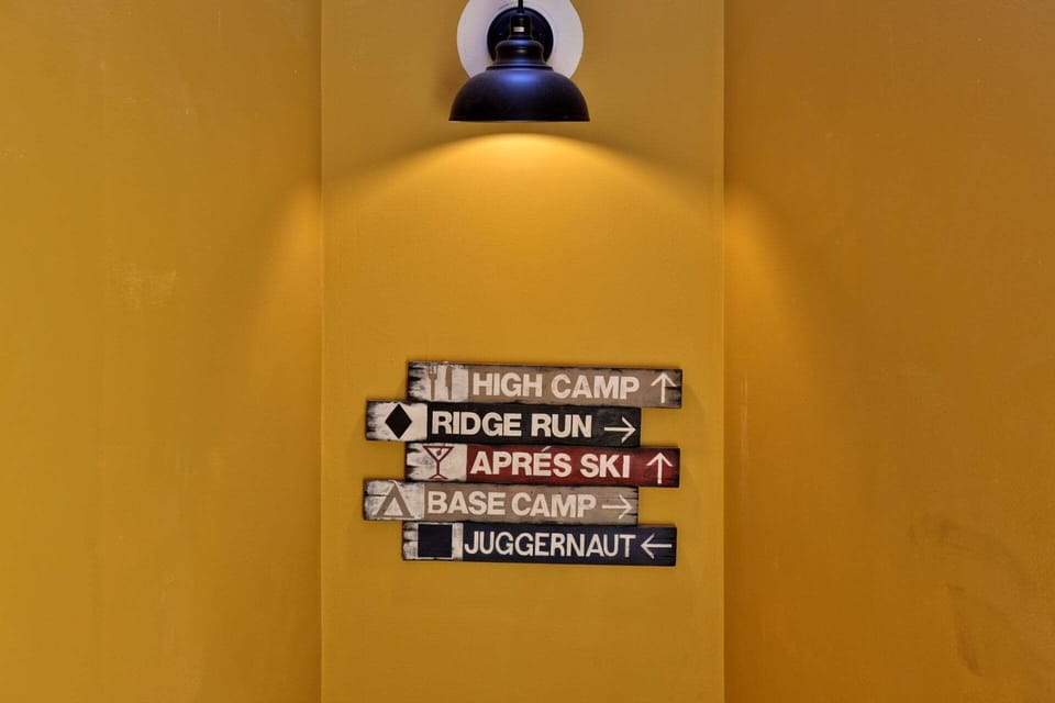 A playful trail sign brings Killington mountain character into the condo hallway.