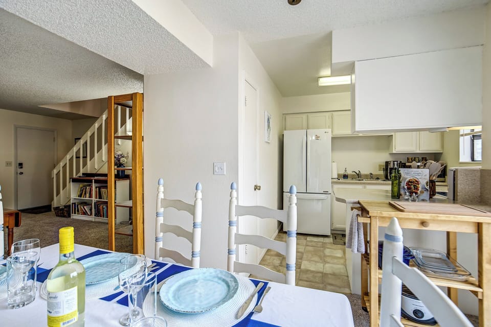 Just off the living room, the dining area offers seating for five, making it easy to enjoy meals together or work remotely.
