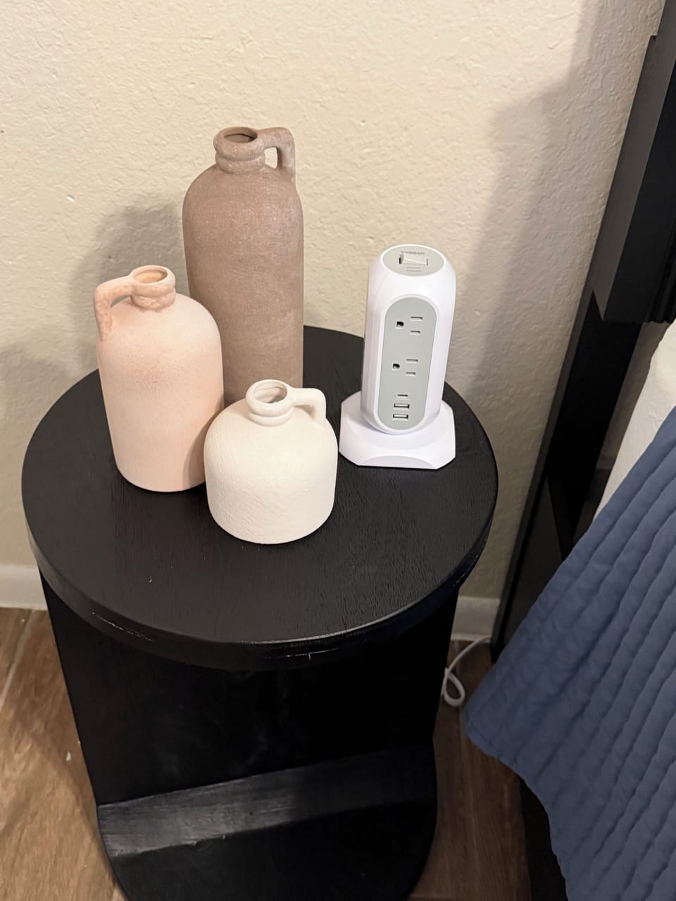 Guest bedroom side table accessories and multi-outlet with surge protector. 