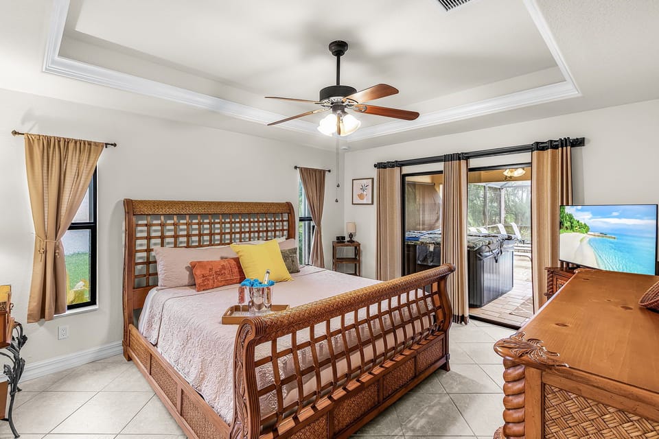 The primary bedroom has a King bed & private sliders to the pool