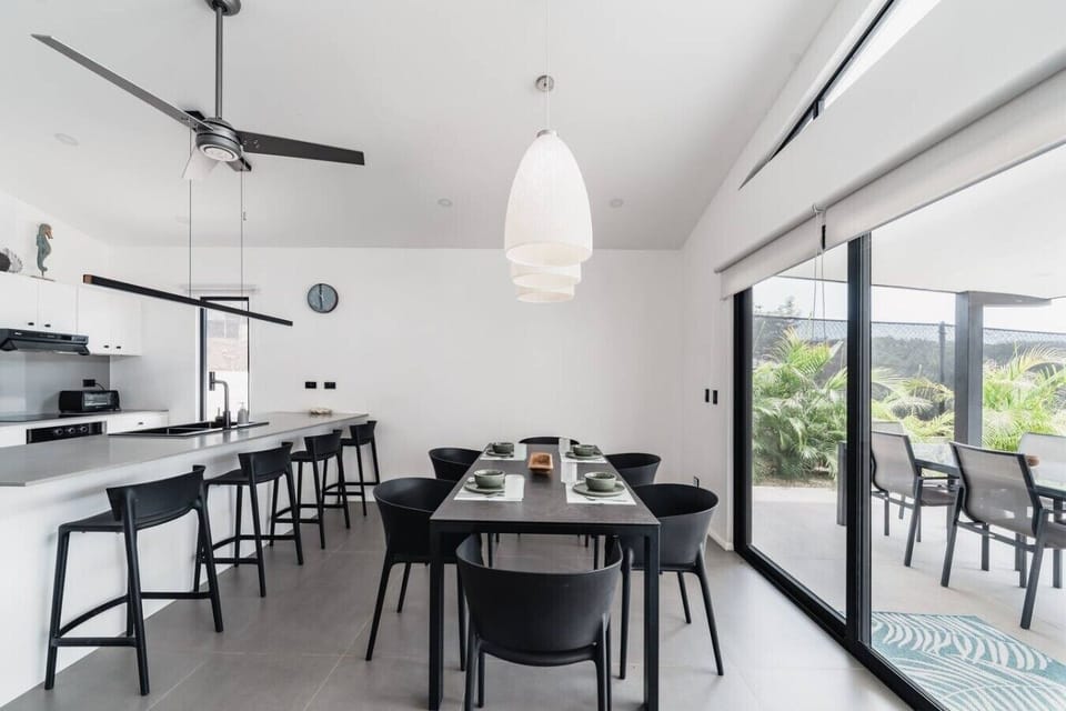 Gather around for meals with the sliding doors wide open and the pool just steps away. The dining area flows effortlessly between the kitchen and the outdoors, exactly as it should be.