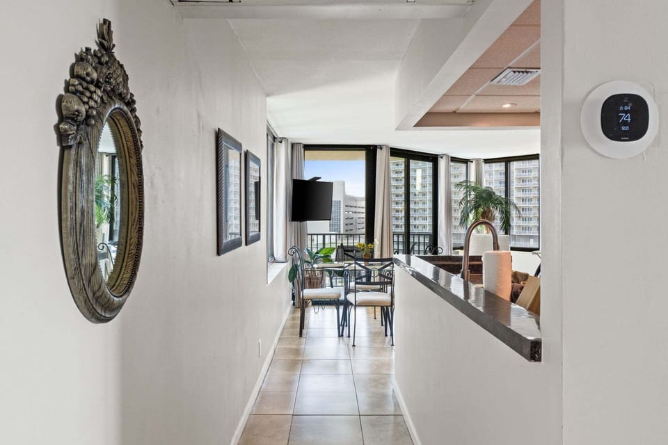 The entrance opens directly into the living, dining, and kitchen area, creating a bright, welcoming space from the moment you walk in