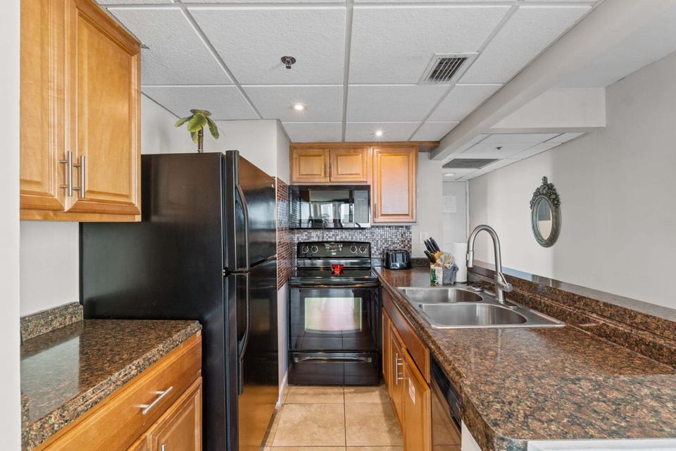 The kitchen offers plenty of counter space, making meal prep easy and comfortable for guests.